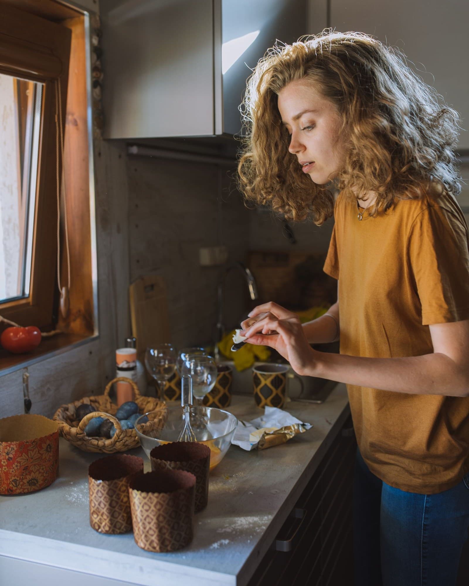 A helper cooking a fresh meal in the kitchen