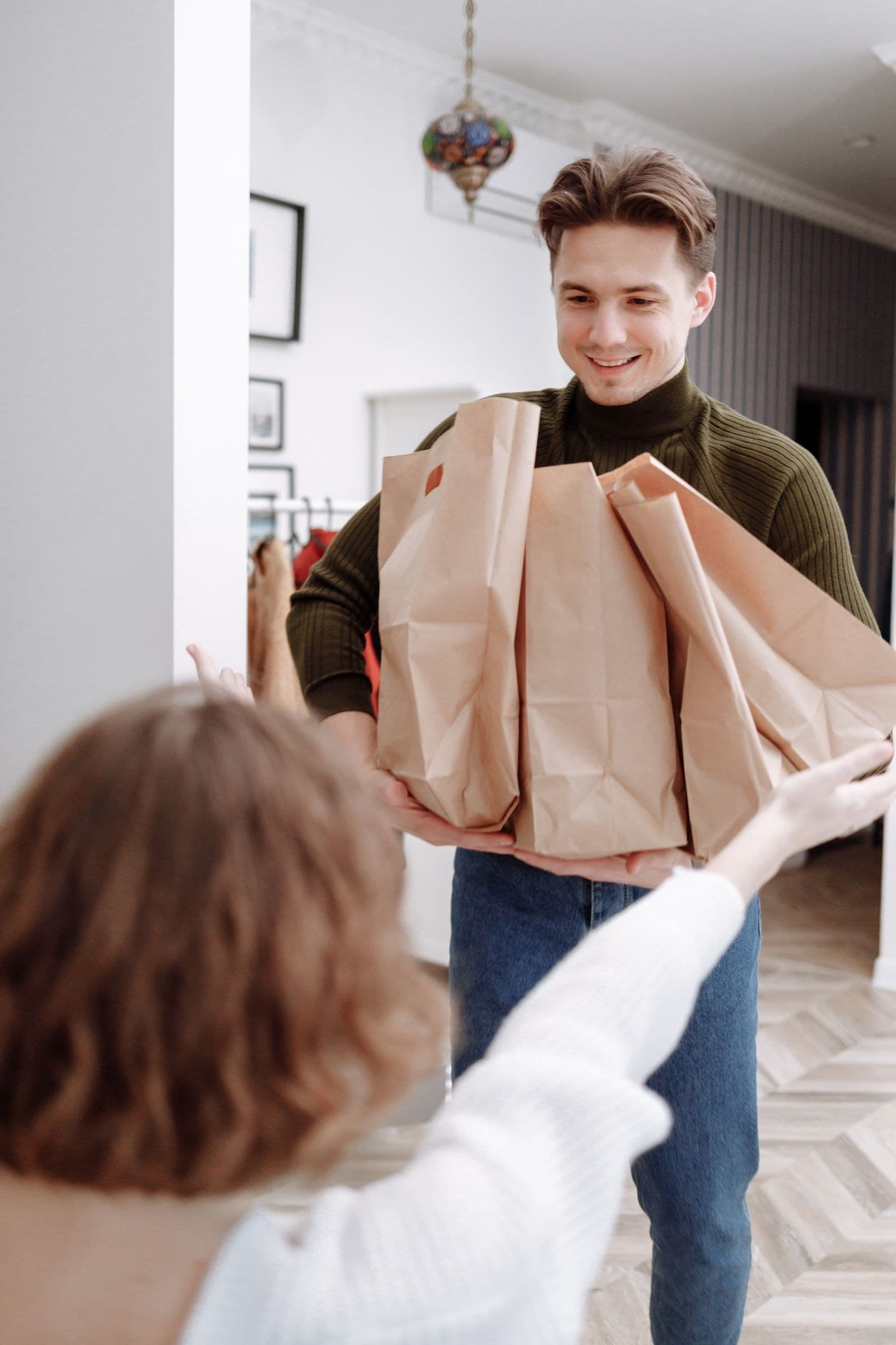 An older woman opening her front door to a Felvo helper